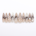Nude designer nails without the case on a white background